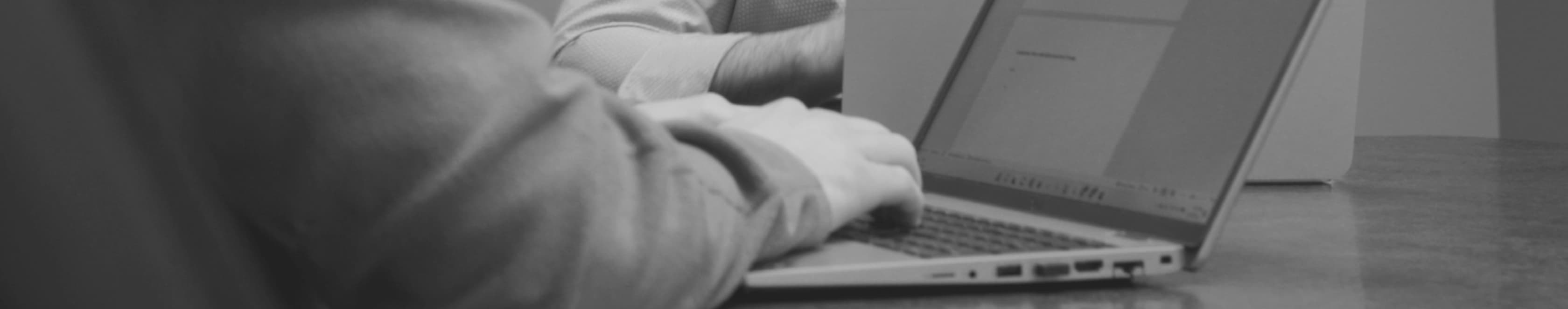 Employee typing at laptop